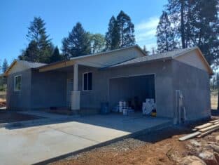 The outside of a newly constructed home ready to be painted